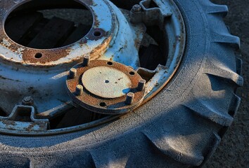 Old tractor wheel with morning rime frost