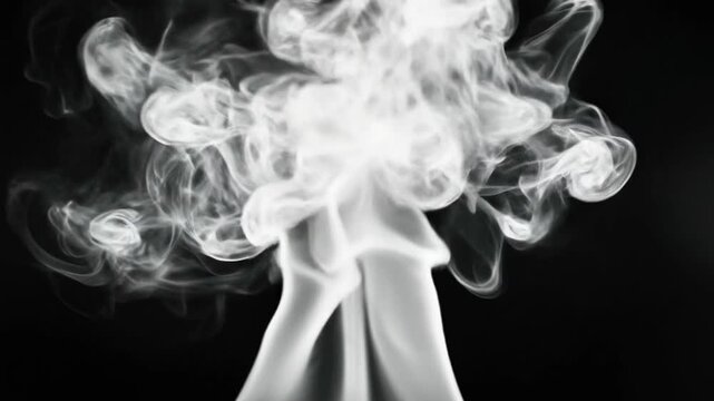 A mesmerizing close-up of swirling white smoke tendrils rising against a stark black background