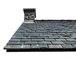 Close-up of a slate roof with a stone chimney on a black background