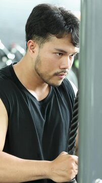 Vertical Close-Up of Man Performing Triceps Cable Rope Pushdowns