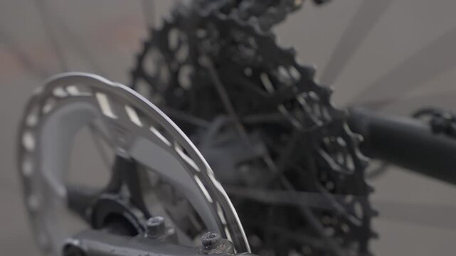 Close up view of bicycle chainring and rear cassette on road bike