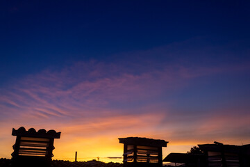 Silhouette of building with twilight sky background