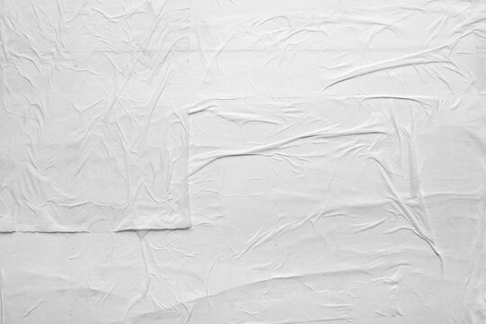 white crumpled and creased glued wrinkled paper poster texture background