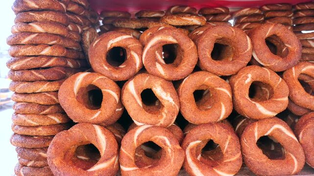 Fresh bread rings turkish simits stacked in bakery display case