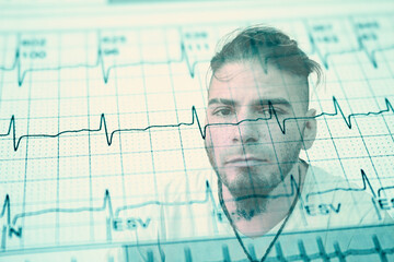 Worried adult male face over damaged electrocardiogram