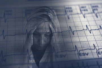 Worried adult woman face over damaged electrocardiogram showing cardiac distress