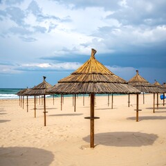 A serene beach scene with thatched umbrellas on sandy shore
