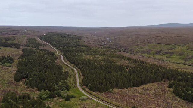 Drone shot of a dirt track on a peat moor on the Outer Hebrides of Scotland.