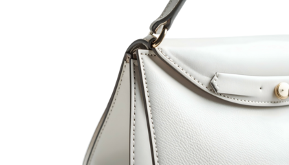 Close-up of a structured, off-white handbag with a top handle and gold hardware