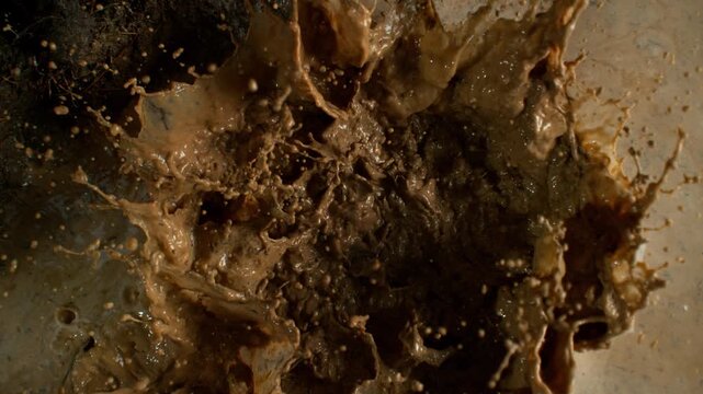 Super Slow Motion Shot of Splashing Mud Background at 1000fps.