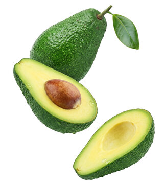 juicy ripe avocado cut in half, revealing its creamy flesh and brown seed, with water droplets and a leaf, isolated on black