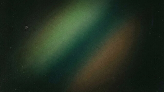 A moody, abstract image with a soft diagonal gradient of muted green, obscured by heavy grain and scratches.