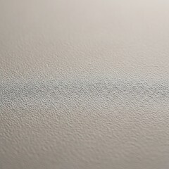 Subtle gray paper backdrop with minimalist grainy pattern detail