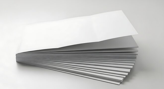 Stack of blank white paper sheets on a light gray background.