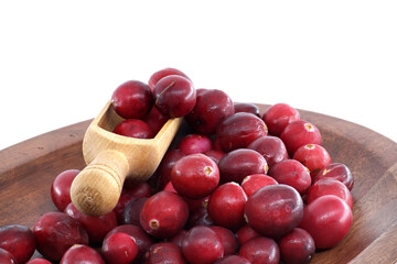 Fresh Red Cranberries in Wooden Scoop on Wooden Plate for Health, Food, and Holiday Meals