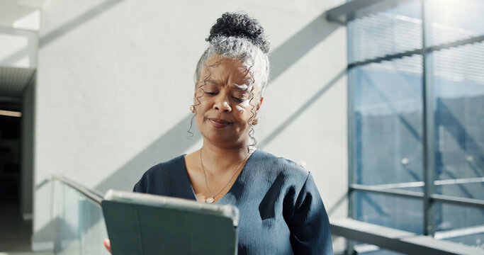 Confused, woman and reading in office with tablet, administration error or wrong HR report for payroll. Mature person, human resources employee and doubt with tech, email review or timesheet mistake.