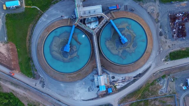 Aerial view Industrial water treatment facility with sedimentation tanks pulp in copper and gold mining factory.