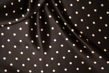 black and white polka dot fabric background © James Burger
