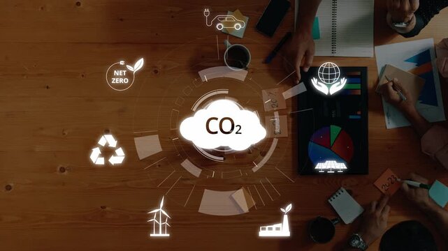 Dynamic workspace showcasing strategies to reduce CO2 emissions. Visualize sustainability efforts with renewable energy icons, data analysis, and team collaboration for a greener future. Raster