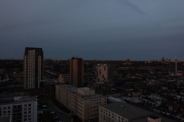 Naklejka premium Toronto cityscape showcasing residential and commercial buildings under a muted evening sky, capturing urban life and architectural diversity in ontario, canada