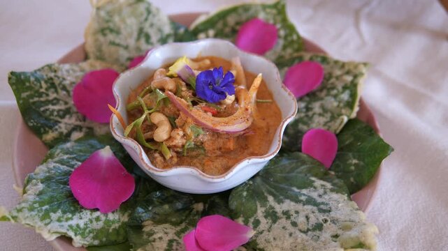 Traditional Thai Miang Kham with Spicy Sauce Served on Decorative Leaves, Authentic Thai Appetizer