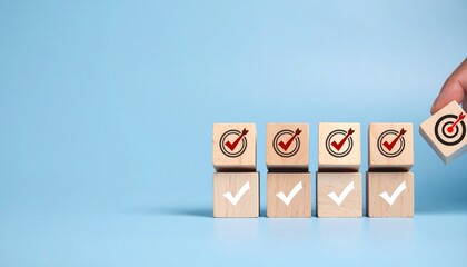 Goal achievement and business success concept with hand placing wooden block with target icon among check mark blocks on blue background for task management, strategy planning, and project milestone