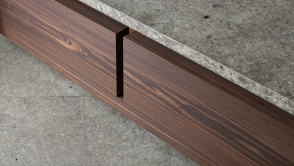 A detailed close-up of a modern architectural detail, showing a precisely crafted dark wood plank with a clean groove joint set against a raw concrete surface.
