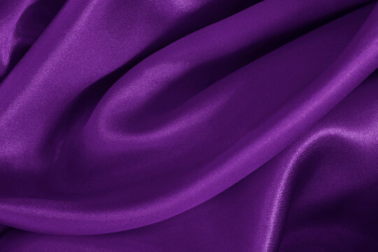 Purple fabric cloth texture for background and design art work, beautiful crumpled pattern of silk or linen.