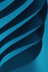 Obraz premium Blue curved paper abstract background with elegant wavy layers and deep shadows for creative graphic design, modern art presentation, and corporate branding wallpaper