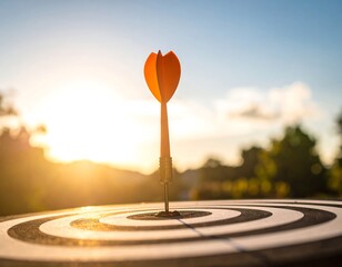 Dart hitting target at sunrise outdoors.