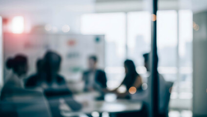 Blurry view through glass of people meeting in a bright modern office while discussing business ideas in a collaborative corporate environment filled with natural daylight and professionalism