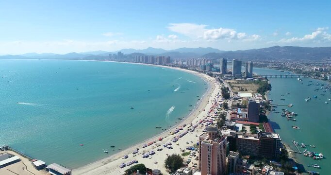 A dynamic aerial time-lapse captures the rhythmic flow of a global port, where synchronized cranes and cargo ships move against a dramatic sky at golden hour.