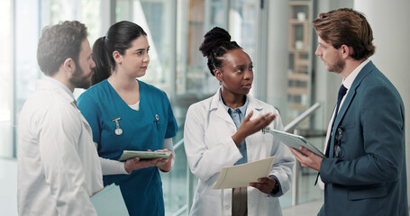 Businessman, doctors or meeting with folder in clinic for medical admin, patient system or planning. People, healthcare team and HR manager with tech for insurance claim, staff policy and compliance