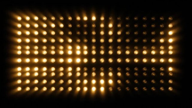 A grid of golden lights forming a rectangular shape against a dark background, viewed from a straight-on perspective.