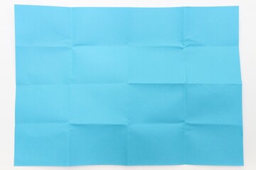 Folded blue paper, white background