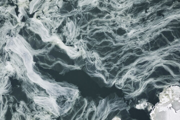 Obraz premium Freezing ice floes on the river, abstract background in winter