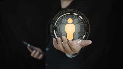 Business professional holding digital human icon interface, representing human resources management, customer data, user profile, global network, digital identity,  people-centric technology concept.