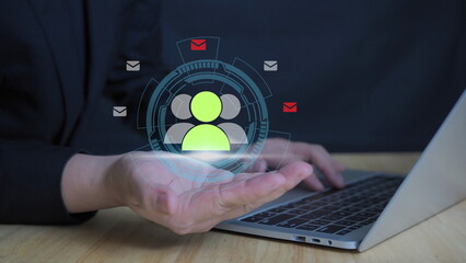 Business professional using digital customer group interface with email icons, representing CRM system, email marketing, customer communication, data management, user engagement, and digital business 
