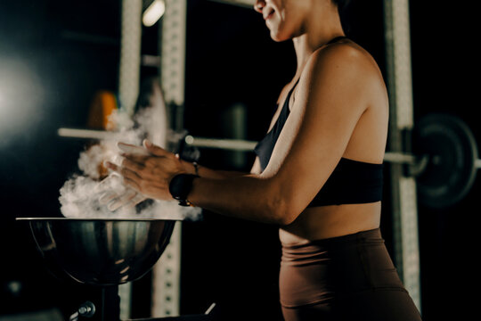 Athlete woman doing fitness training at the gym.  Workout and indoor sport.
