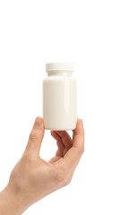 Hand holding a white medicine bottle.