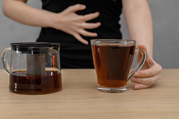 Tea with mint for stomach ache, drink the brewed infusion in a glass cup