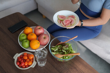 Woman enjoying healthy fresh fruit and vegetable snack