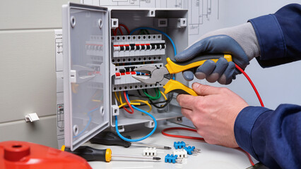 electrician working in electrical panel
