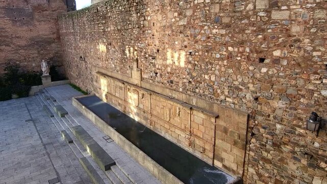 Medieval watering trough. Medieval construction for the use of horses. Pillar of San Francisco. Forum of the Balbos. Monumental City of C&aacute;ceres.