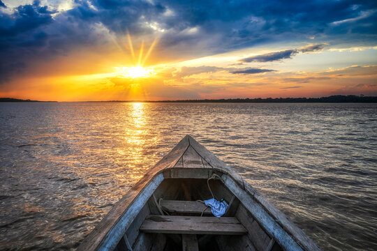 Boat Travel on Amazon River at sunset