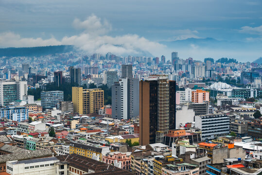 Buildings of Quito, Ecuador under stormy and rainy skies