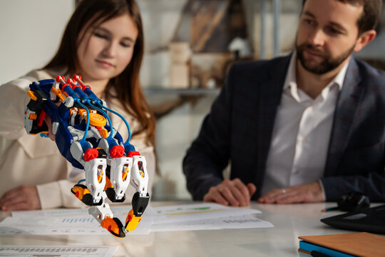 irl and man working with hydraulic robotic arm. STEAM education