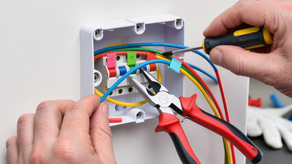 electrician repairing a power supply
