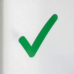 Green check mark symbol on a white background.