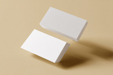 Two blank white business cards floating on beige background